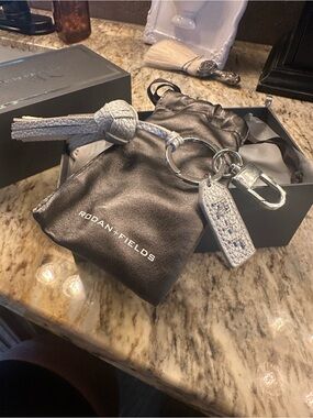 Rodan + Fields Metallic Silver Leather Key & Tassel Holder